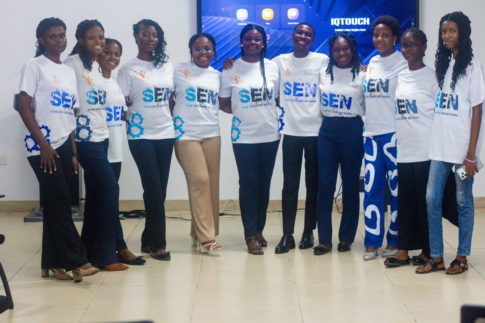 SEN volunteers and young leaders pointing forward