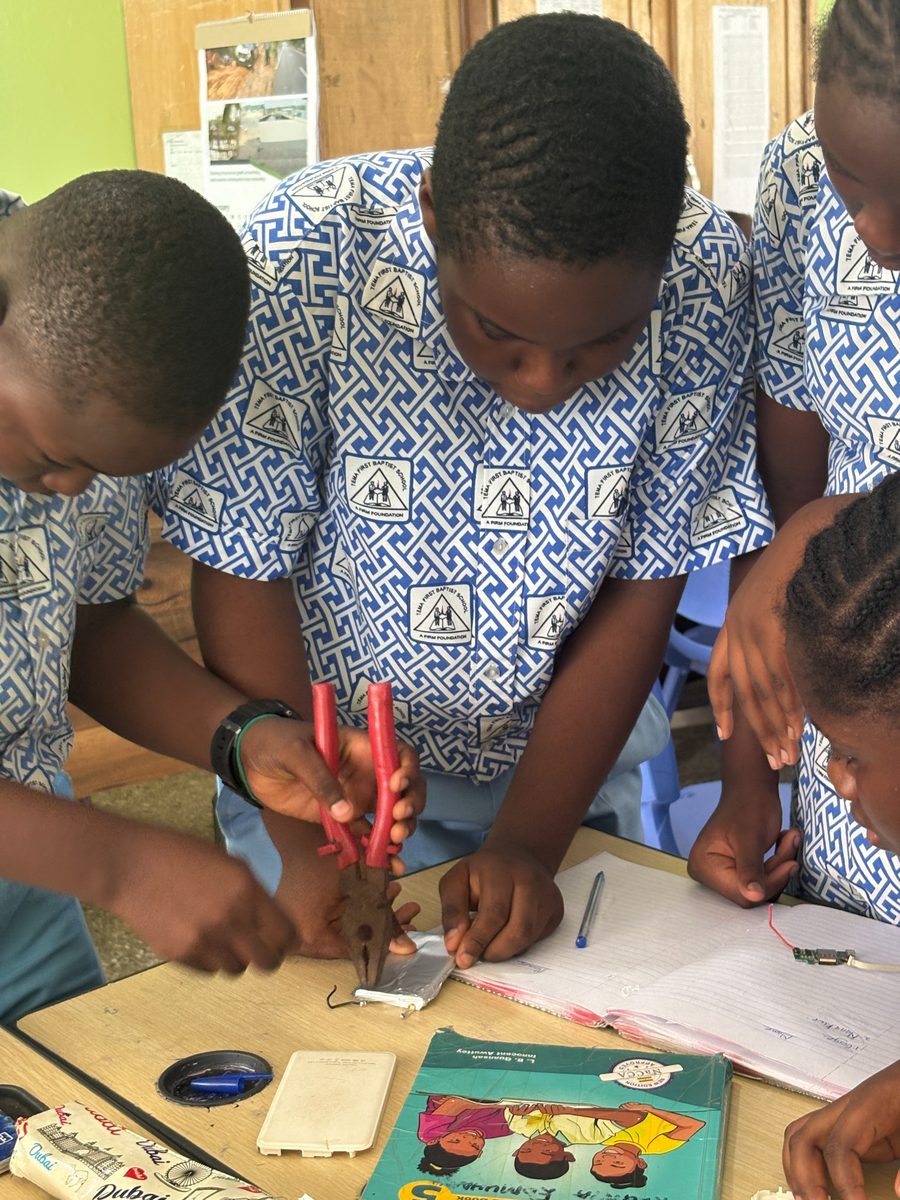 Pupil examining a component during Little Innovators Workshop